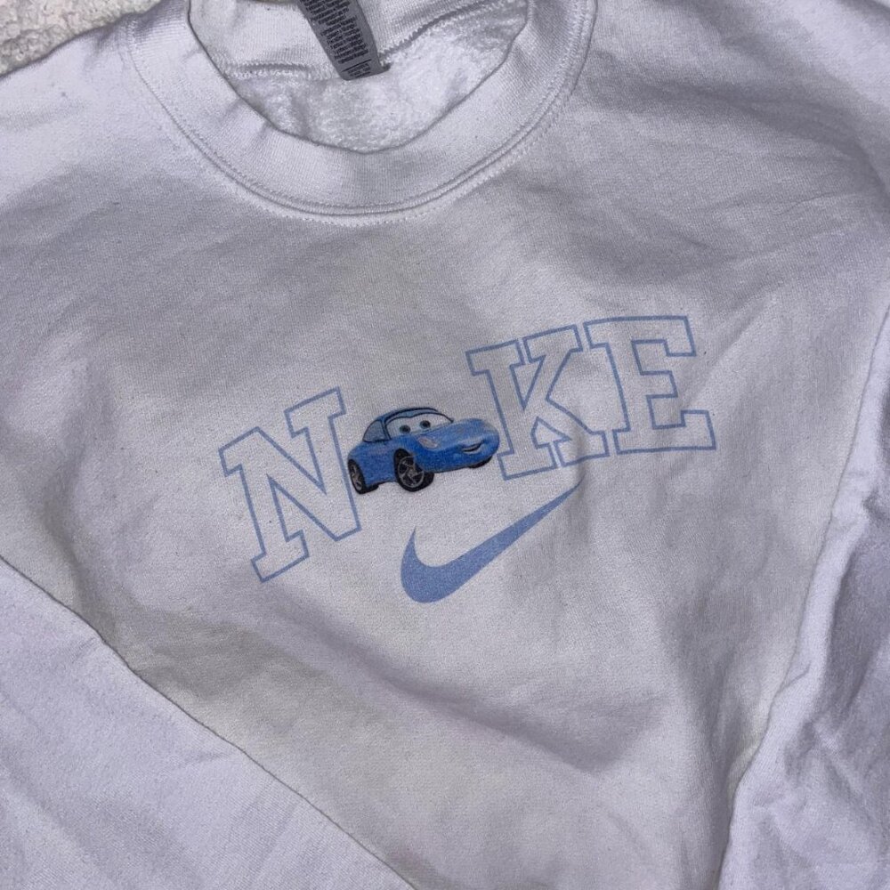 white gildan pullover with Sally Nike logo💙💙 size S but is a bit tight